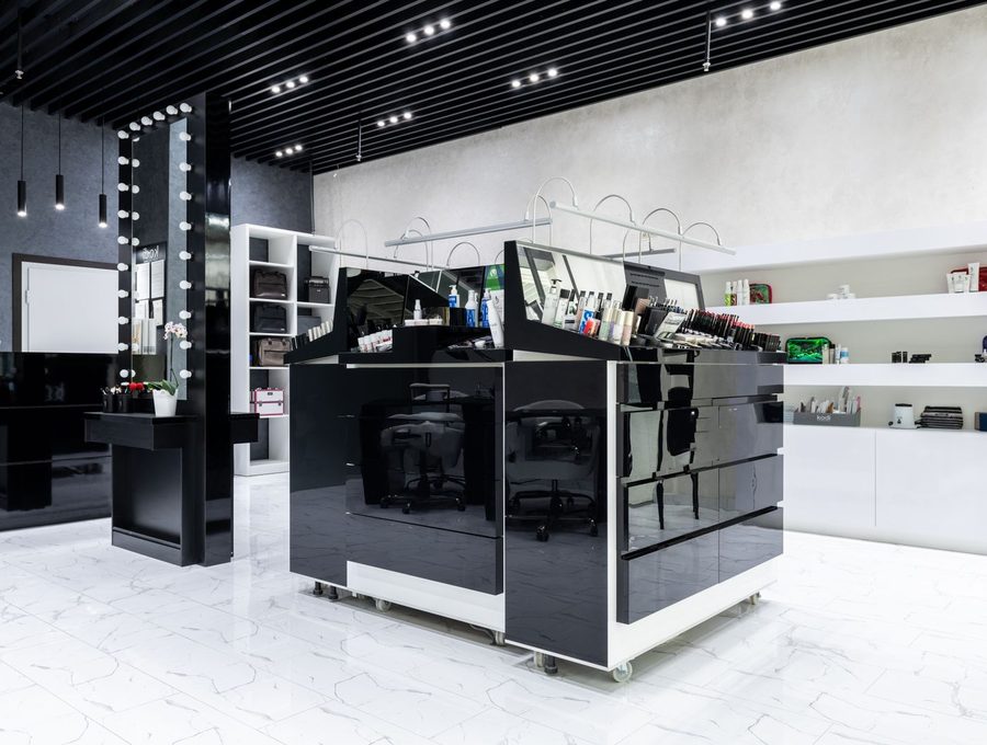 A modern cosmetics store with lit display units